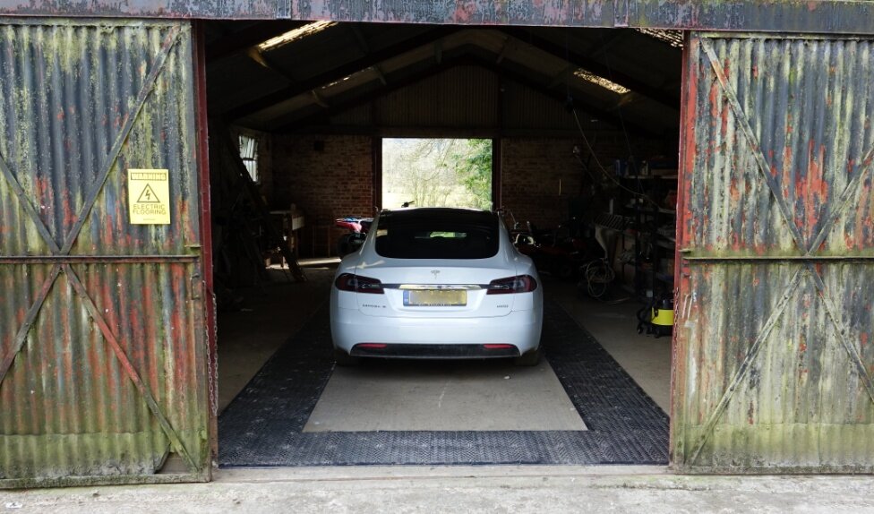 Tesla On RatMat in garage